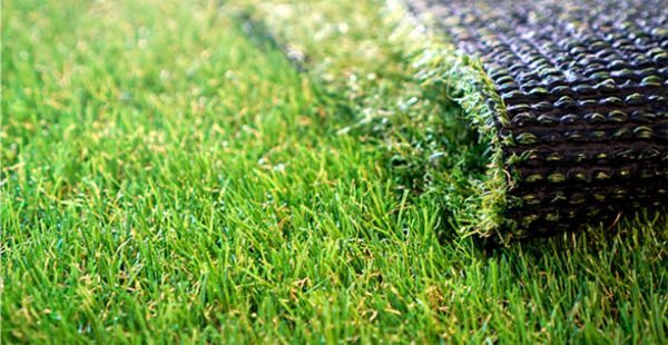 Close-up of artificial grass and its backing